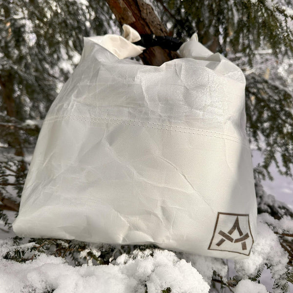 Adotec Gear bear-resistant food bag designed to keep food safe from wildlife in snowy outdoor environments
